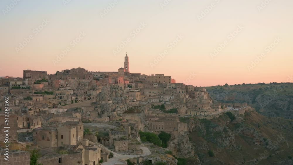 Stunning view of the Matera’s skyline during a beautiful sunrise. Matera is a city on a rocky outcrop in the region of Basilicata, in southern Italy. Stunning view of the Matera’s skyline during a beautiful sunrise. Matera is a city on a rocky outcrop in the region of Basilicata, in southern Italy.