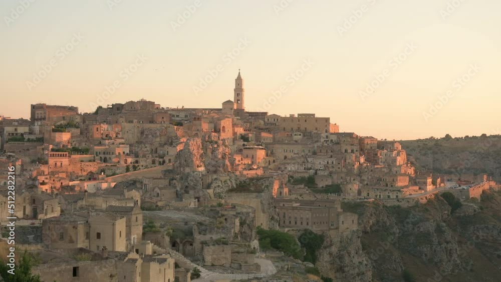 Stunning view of the Matera’s skyline during a beautiful sunrise. Matera is a city on a rocky outcrop in the region of Basilicata, in southern Italy. Stunning view of the Matera’s skyline during a beautiful sunrise. Matera is a city on a rocky outcrop in the region of Basilicata, in southern Italy.