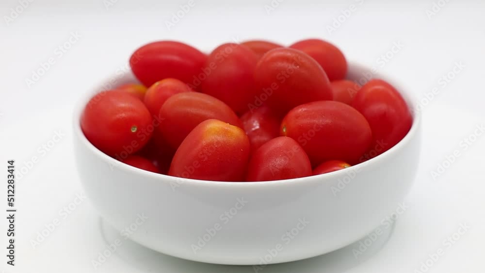 Fresh Cherry tomatoes in a bowl rotating Fresh Cherry tomatoes in a bowl rotating