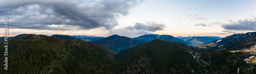 Sunrise in the Carpathians, misty mountains and spruce forests in the nature park.