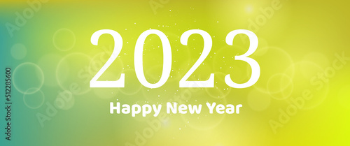 Happy new year 2023 incription on blurred background