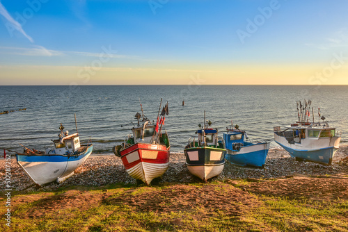 colorful fishing boats in the first rays of sun, the Baltic Sea in Poland