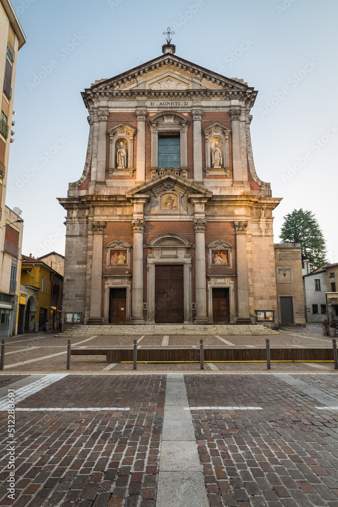 Italian church. Historic center of Somma Lombardo (Sum Lombard), Lombardy, Italy. Square Vittorio Veneto and the Basilica of Sant'Agnese (1665 AD) in the early morning