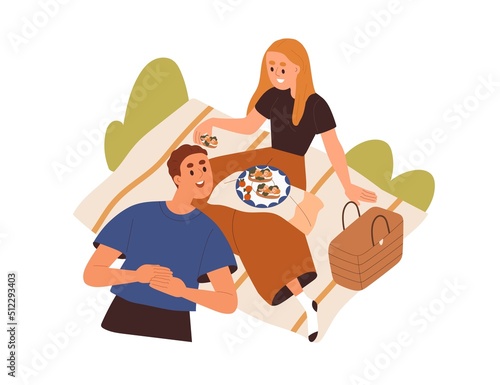 Love couple relaxing on summer picnic, eating food. Happy man and woman resti...