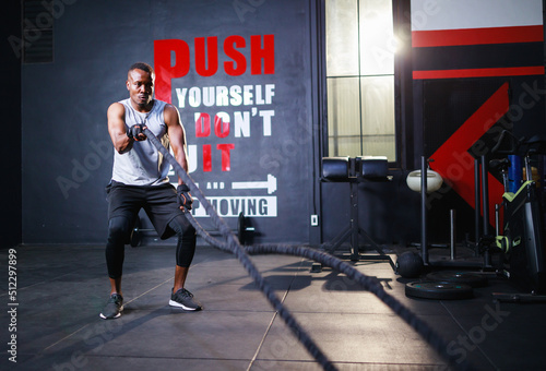 Black African American man doing workout at the gym. Sports and health care concept