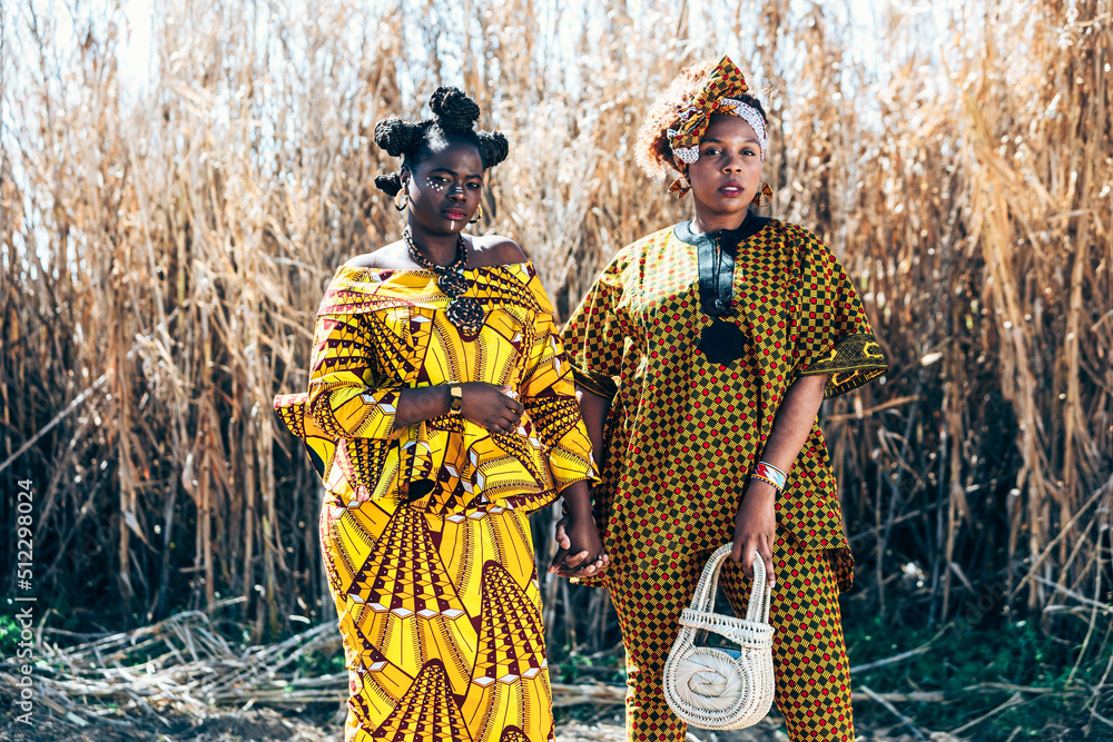 Confident African women in traditional outfits Stock Photo | Adobe Stock