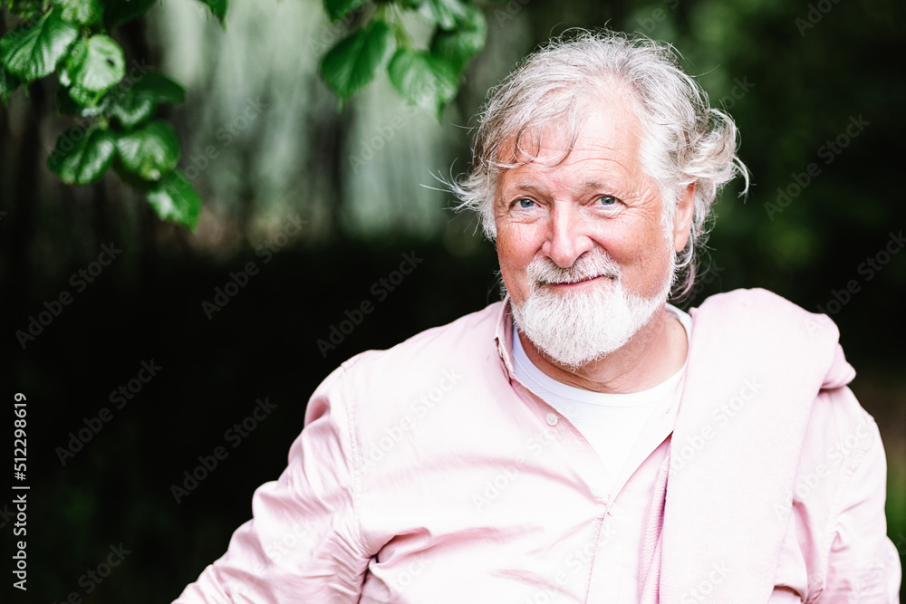 Senior man standing in countryside Senior man standing in countryside