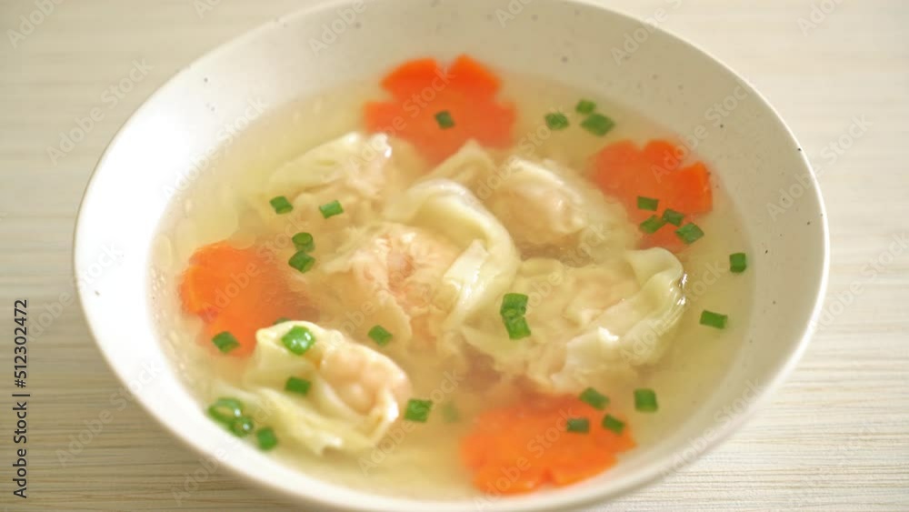 shrimp dumpling soup in white bowl - Asian food style shrimp dumpling soup in white bowl - Asian food style
