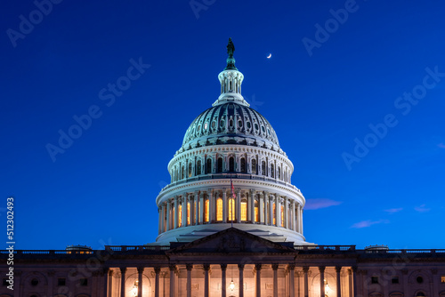 Looking Up to the US Capitol Dome at Night with Moon in the sky