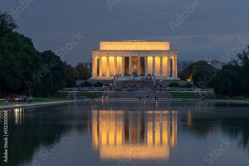 Night View of the Lincoln Memorial with Multiple Tourist Relaxing on the Stairs