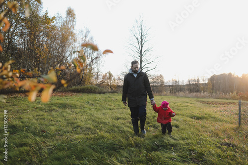 Happy father and child spending time outdoors. father with daughter in autumn park