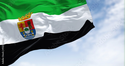 Tableau sur toile The Extremadura flag waving in the wind on a clear day