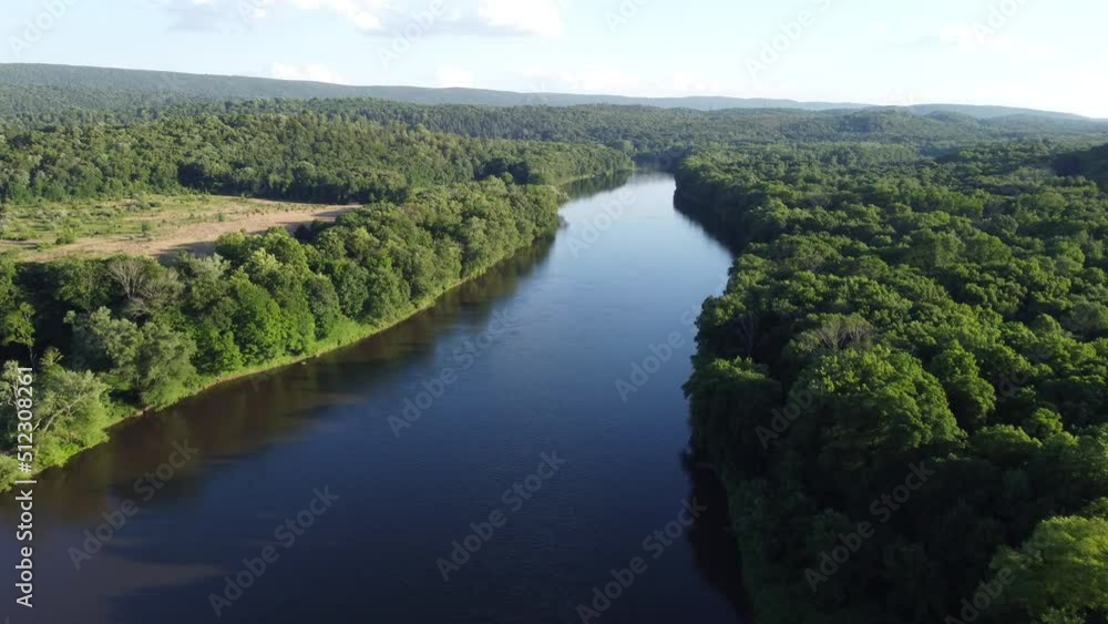 aerial view overlooking river and trees aerial view overlooking river and trees