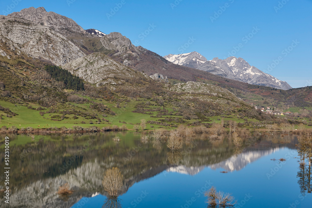 Beautiful reservoir and mountain landscape in Riano. Mirror effect. Spain