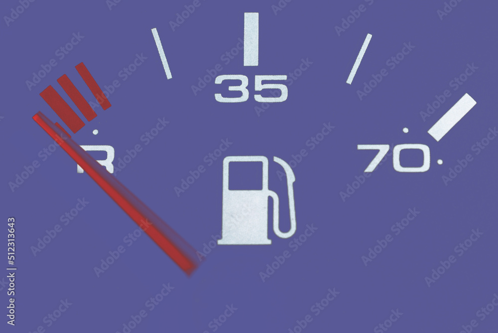 Fuel gauge showing and empty tank.Car Fuel Gauge Showing Empty, close up.Toned.Veri peri,purple background color. Fuel gauge showing and empty tank.Car Fuel Gauge Showing Empty, close up.Toned.Veri peri,purple background color.