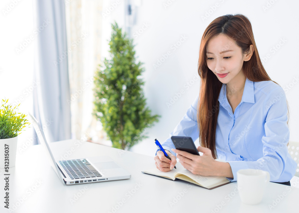 Beautiful Asian young business woman working in the office Beautiful Asian young business woman working in the office