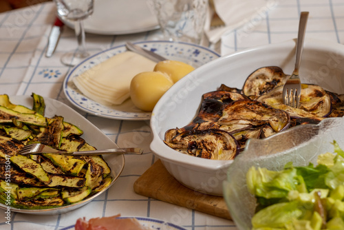 grilled vegetables, eggplants and zucchinis on laid table