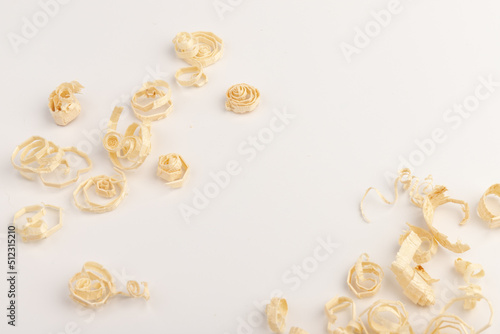 Wood chips isolated on light background. Wooden shavings.