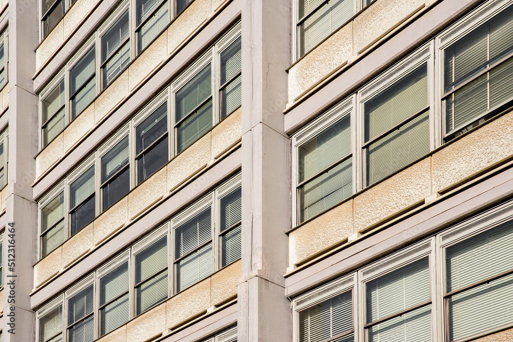 Fototapeta premium Facade of a building with many windows. The building is for office use.