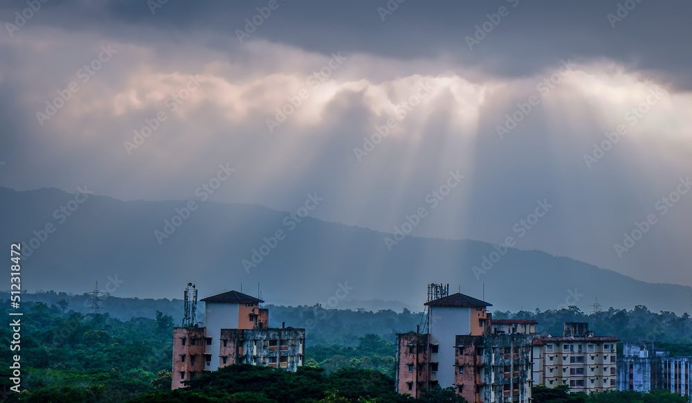 dramatic sun rays falling on the buildings