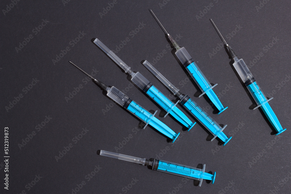Disposable plastic syringe prepared for injection and vaccination in the hospital. The concept of medicine and health Disposable plastic syringe prepared for injection and vaccination in the hospital. The concept of medicine and health