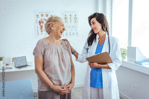 Internist and patient during medical consultation in the doctor's office. Doctor working in the office and listening to the patient, she is explaining her symptoms, healtcare and assistance concept © Dragana Gordic