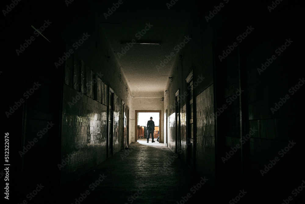 silhouette of a person in a tunnel