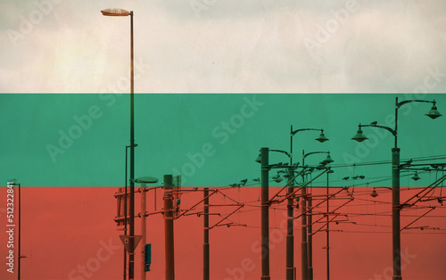 Bulgaria flag with tram connecting on electric line with blue sky as background, electric railway train and power supply lines, cables connections and metal pole overhead catenary wire