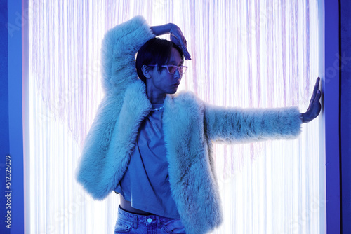 Tablou pe pânză Waist up portrait of extravagant Asian man entering stage at vogue dance party i
