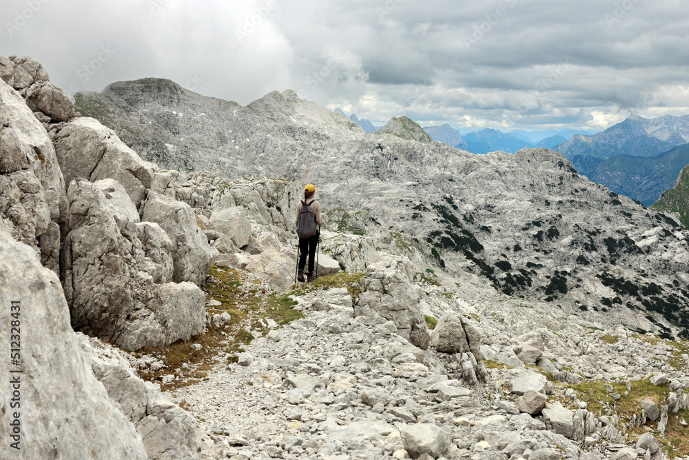 Adult Female Trekker Enjoying the Hike on the top of Julian Alps