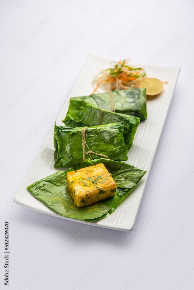 patrani paneer, a paneer marinated in sauce and barbecued and then covered in leaf patrani paneer, a paneer marinated in sauce and barbecued and then covered in leaf