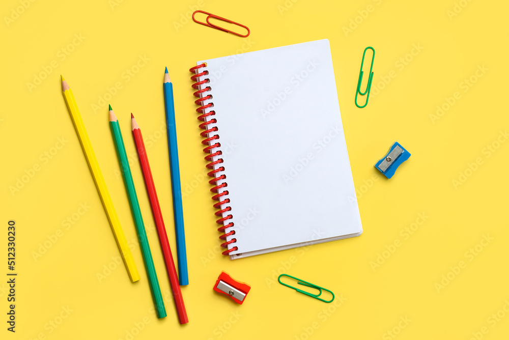 Top view of school supplies and spiral notepad with space for text. Back to school concept Top view of school supplies and spiral notepad with space for text. Back to school concept