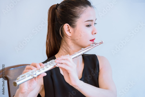 Girl with a flute isolated background. photo