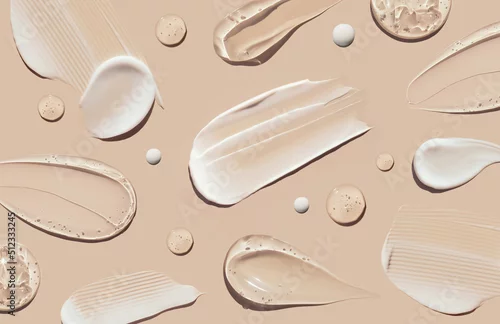 Obraz pattern cosmetic smears of creamy texture on a pastel beige background