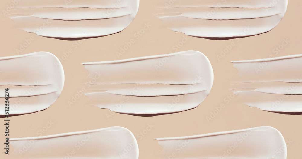 pattern cosmetic smears of creamy texture on a pastel beige background pattern cosmetic smears of creamy texture on a pastel beige background