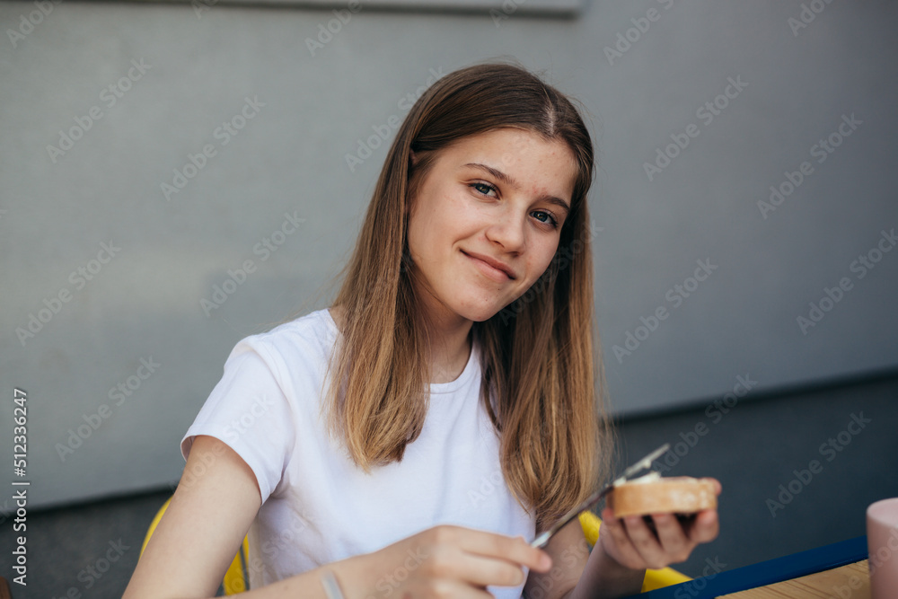 portrait of caucasian teenager girl having breakfast portrait of caucasian teenager girl having breakfast
