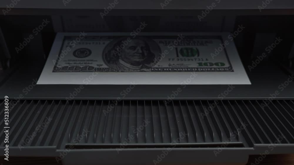 Print on a counterfeit one hundred dollar bill. Fake money, illegal actions. Illegal printing of