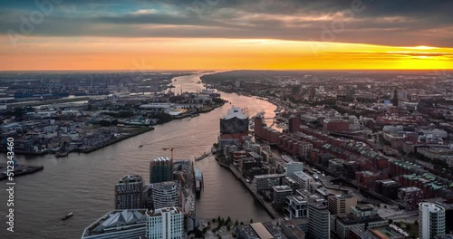 A summer sunset in Hamburg, Germany. Aerial view on Hamburg Elbphilarmonie and port. Time Lapse.