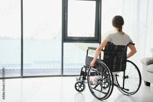 Young woman sitting in a wheelchair