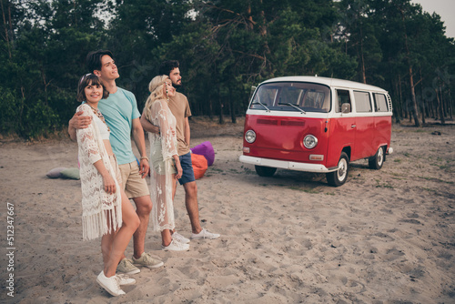 Photo of cheerful positive freinds embrace prepare leave camp wear boho outfit nature seaside beach outdoors