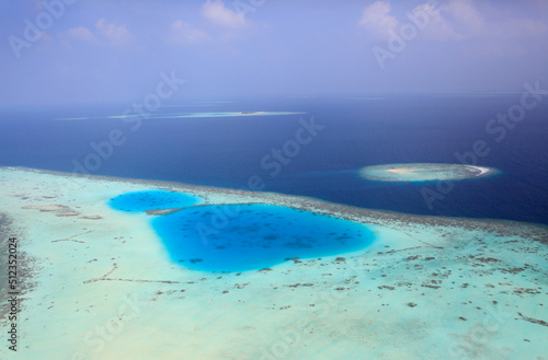 Aerial view of a maldivian island, Maldives photo