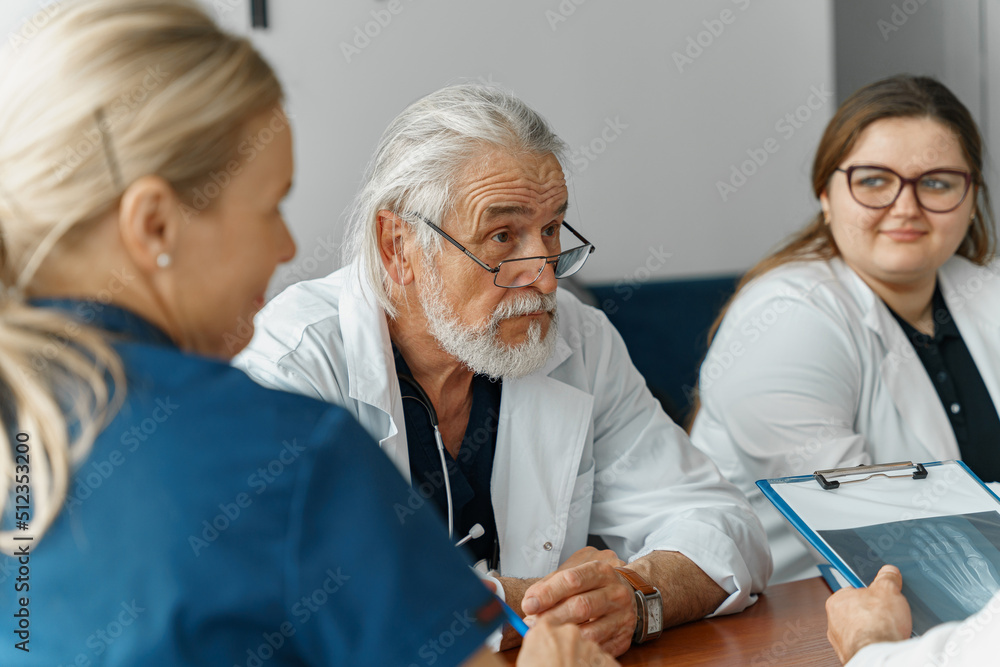 Successful medical doctors are discussing diagnosis during the conference Successful medical doctors are discussing diagnosis during the conference
