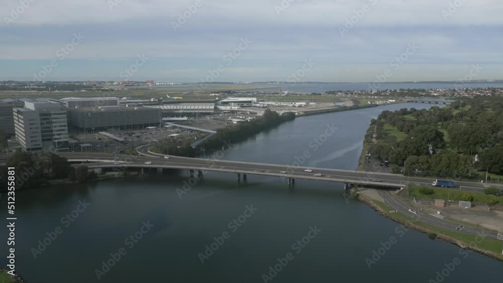 Two lane bridge highway at Sydney International Airport. Australia. Static aerial view on a cloudy day. Two lane bridge highway at Sydney International Airport. Australia. Static aerial view on a cloudy day.