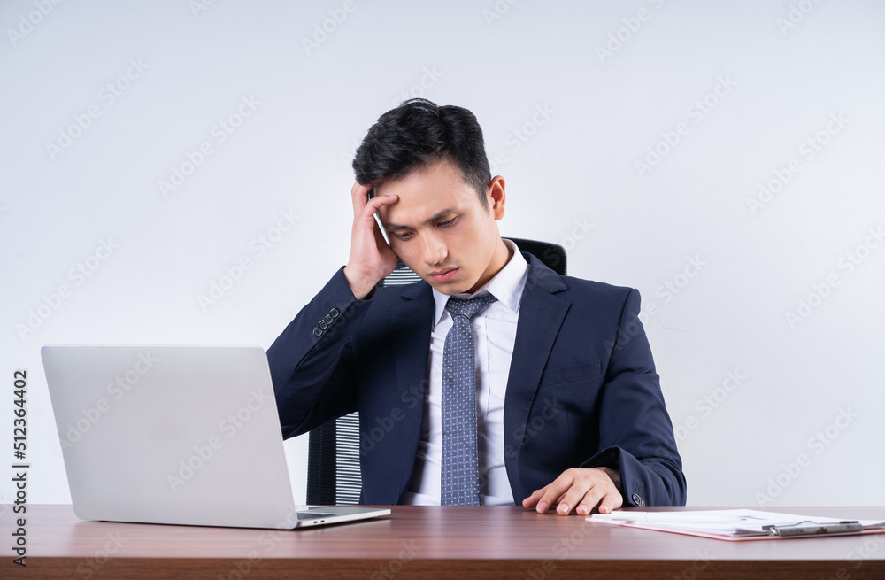 Image of young Asian businessman on background Image of young Asian businessman on background
