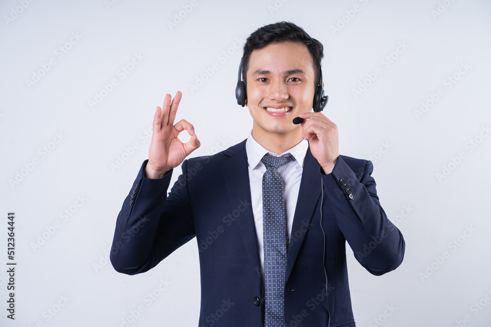 Image of young Asian businessman on background Image of young Asian businessman on background