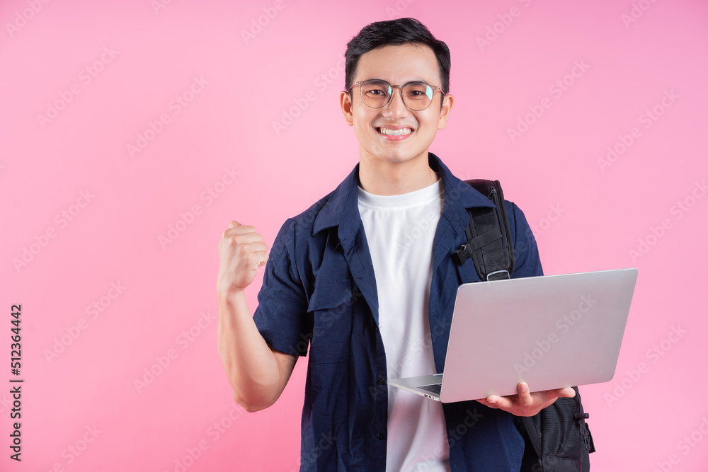 Image of young Asian college student on pink background Image of young Asian college student on pink background