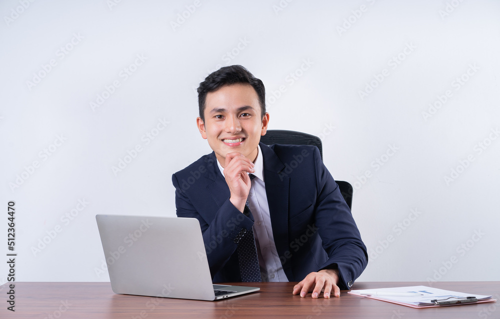Image of young Asian businessman on background Image of young Asian businessman on background