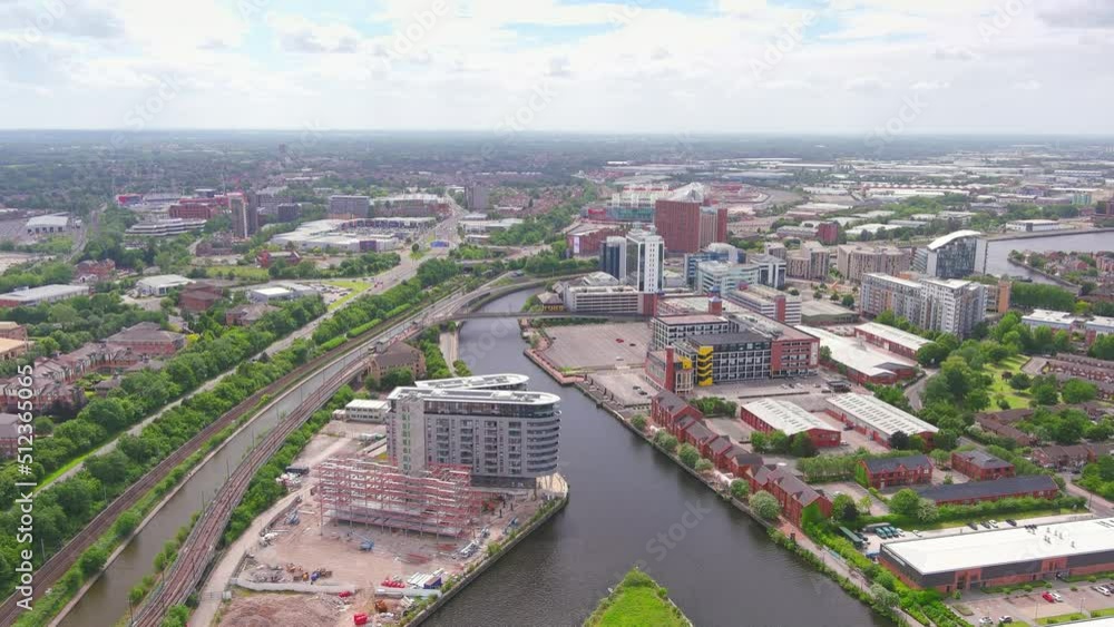 Manchester, UK: Aerial view of city in England, suburb with greenery and river Irwell - landscape panorama of United Kingdom from above Manchester, UK: Aerial view of city in England, suburb with greenery and river Irwell - landscape panorama of United Kingdom from above
