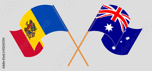 Crossed and waving flags of Moldova and Australia