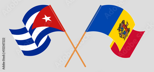 Crossed and waving flags of Cuba and Moldova